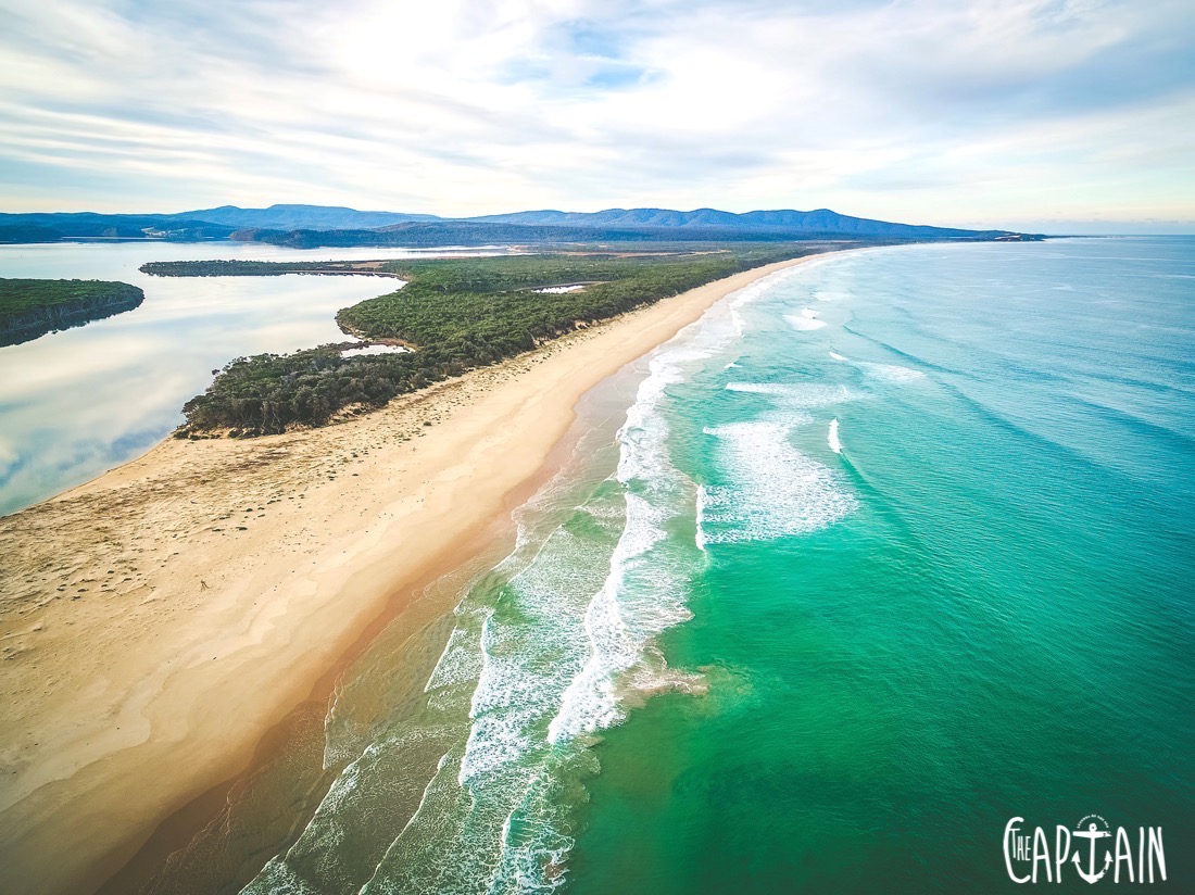 Aerial view of ocean coastline near Mallacoota town, Victoria, Australia